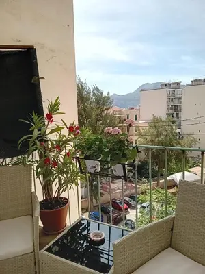 a balcony with potted plants and a table at BBX Palermo Centro in Palermo
