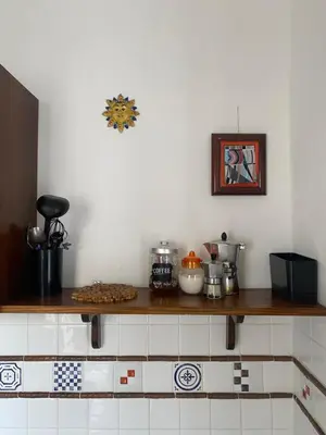a kitchen with a counter top with some food on it at Quiet and comfortable apartment in Palermo city centre in Palermo