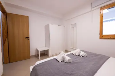 a bedroom with a bed with two towels on it at Apartment on the Beach - Large Terrace in Alcamo