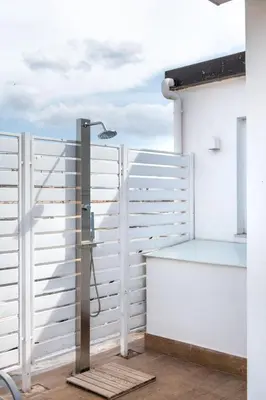 a shower on a balcony with a white fence at Vista sulle Cupole by Wonderful Italy in Palermo