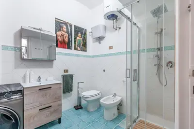 a bathroom with a toilet sink and a shower at Lea's Luxury Art Apartment by Wonderful Italy in Palermo