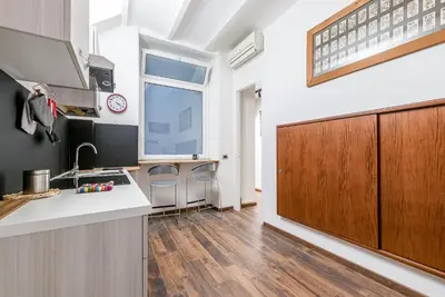 a kitchen with a sink and a counter top at Lea's Luxury Art Apartment by Wonderful Italy in Palermo