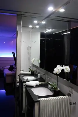 a bathroom with two sinks and a large mirror at Luxury suite 2 min dal Politeama - Free Parking in Palermo