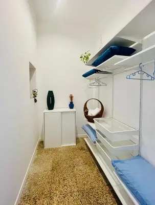 a room with white walls and a staircase with blue ceilings at Da Olga in Palermo