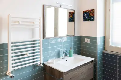a bathroom with a sink and a mirror at Da Olga in Palermo