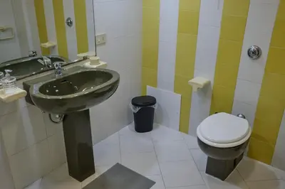 a bathroom with a sink and a toilet at Sea apartment 1 in Palermo