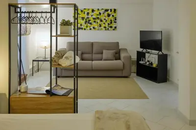 a living room with a couch and a tv at Sea apartment 1 in Palermo