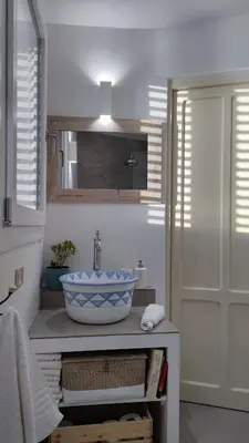 a bathroom with a sink with a bowl on a counter at Casa del Pescatore Terrasini in Terrasini