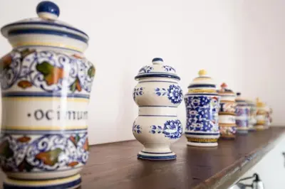 a row of blue and white vases on a shelf at Villa Scirocco Macari in Macari