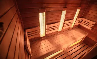 an empty wooden sauna with two lights on it at Blue Life, sea-luxury rooms on the beach between Palermo and Cefalu' in Casteldaccia