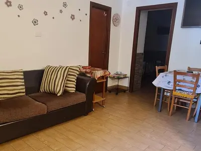 a living room with a couch and a table at La casa di Minù in Palermo