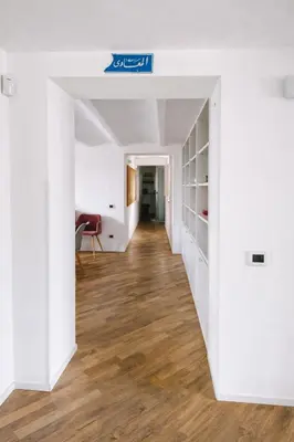 an open hallway with white walls and wood floors at Palazzo Moncada appartamento 2 in Palermo