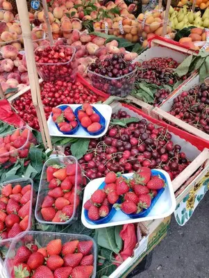 a market with a bunch of fruits and vegetables on display at La Casetta di @Liandro in Palermo