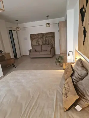 a large living room with a couch in the middle at The waves in Terrasini