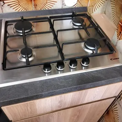 a stove top oven sitting on top of a counter at Mondello Ashur Margot House in Palermo
