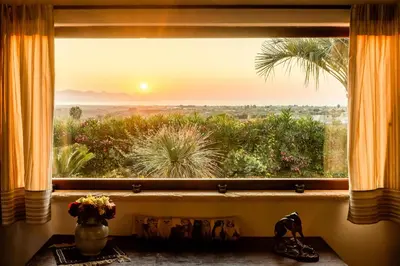 a window with a view of the sunset at Cleo - Villa Siciliana in Partinico