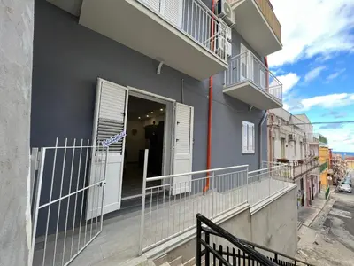 a balcony with an open door on a building at Casa Il Tramonto by Holiday World in Balestrate