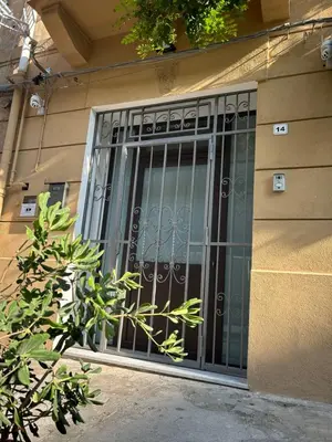 a glass door on the side of a building at Appartamento Olivuzza House in Palermo