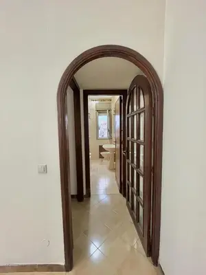 an open hallway with an archway in a house at La casetta di Alice in Palermo