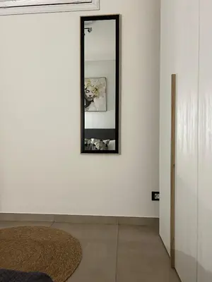 a mirror on a wall in a room at Matteotti35 in Terrasini