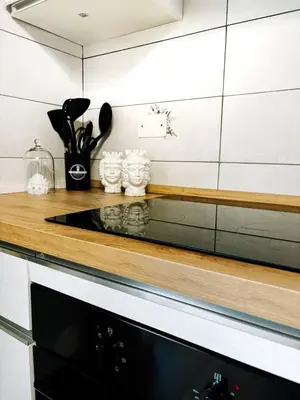 a kitchen counter with a counter top with utensils at A casa di Mamma in Palermo
