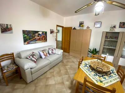 a living room with a couch and a table at Casa Vacanze Villino Nando in Palermo