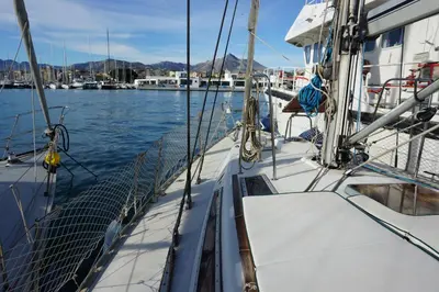 a boat is docked in a body of water at Gloria Sailing in Castellammare del Golfo