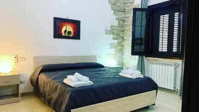 a bedroom with a bed with two towels on it at Casa Graziella Vacanze in Palermo