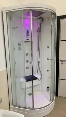 a shower with a glass door in a room at Casa Graziella Vacanze in Palermo