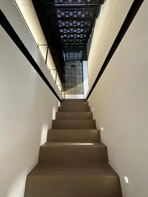 a staircase in a building with a glass ceiling at Le Gemelle Diverse in Cinisi