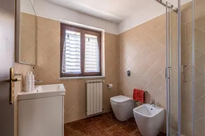 a bathroom with a toilet and a sink and a shower at Le terrazze nel cuore della Kalsa by Wonderful Italy in Palermo