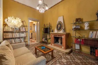 a living room with a couch and a fireplace at Amari Elegant Apartment by Wonderful Italy in Palermo
