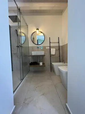 a bathroom with a shower and a sink and a toilet at Sicilian Paradise Casa Vacanze in Castellammare del Golfo