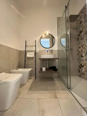 a bathroom with a toilet and a sink and a shower at Sicilian Paradise Casa Vacanze in Castellammare del Golfo