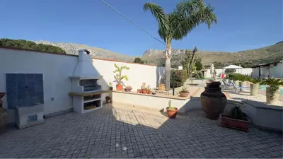 a backyard with a playground with a basketball on the grass at SEALAND TERRASINI in Terrasini