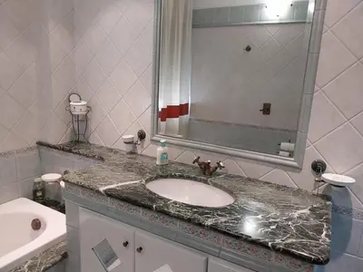 a bathroom with a sink and a mirror at ROOM VISTAMARE PALERMO in Palermo