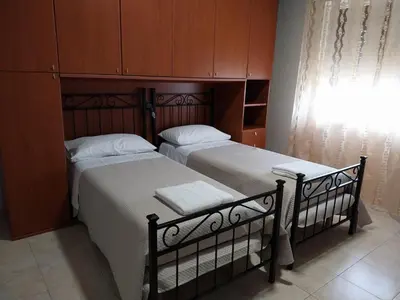 two beds sitting next to each other in a bedroom at ROOM VISTAMARE PALERMO in Palermo