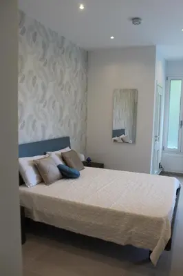 a bedroom with a bed with a blue ball on it at Villa Stesicoro Suite in Mondello