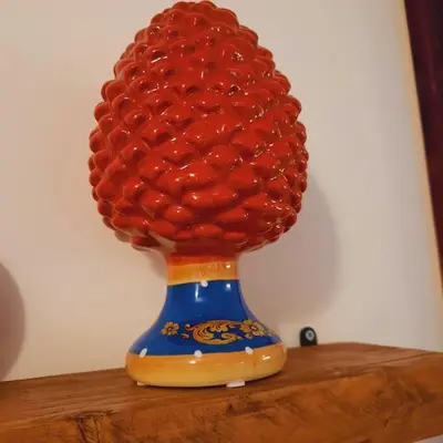a vase with a pile of balls on a table at La Rosa dei venti in Calatafimi