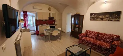 a bedroom with a bed with a black and white comforter at Daysin Apartment in Palermo