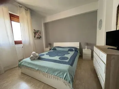 a bedroom with a bed with a teddy bear on it at Petrocelli 364 in Palermo