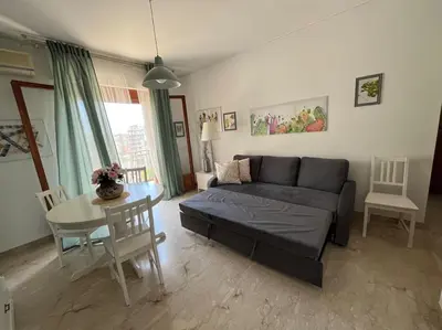 a living room with a couch and a table at Petrocelli 364 in Palermo