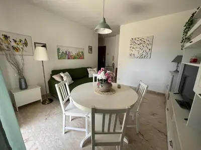 a living room with a table and a couch at Petrocelli 364 in Palermo