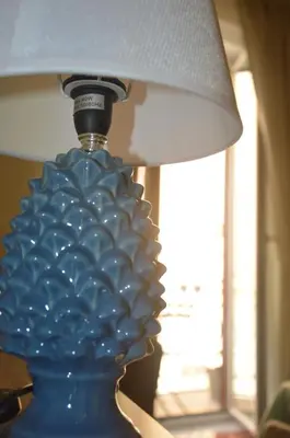 a blue lamp sitting on a table next to a window at Domus Maqueda - Pressi Teatro Massimo in Palermo