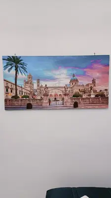 a painting of a large building on a wall at Casa Diema in Palermo