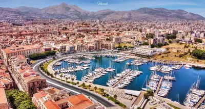 a city with boats docked in a harbor at Casa Diema in Palermo