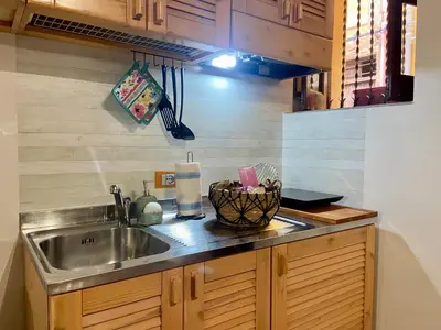 a kitchen with a sink and a counter top at Casa Labi in Termini Imerese