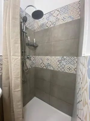 a bathroom with a shower with a shower curtain at Casa Labi in Termini Imerese