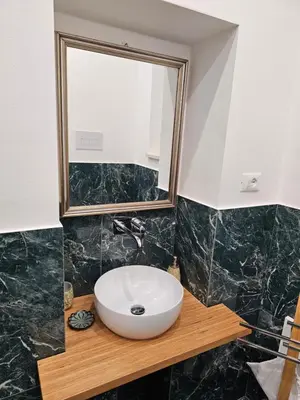 a bathroom with a sink and a mirror at Lu Màri case vacanze in Balestrate