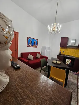a living room with a couch and a table at Lu Màri case vacanze in Balestrate